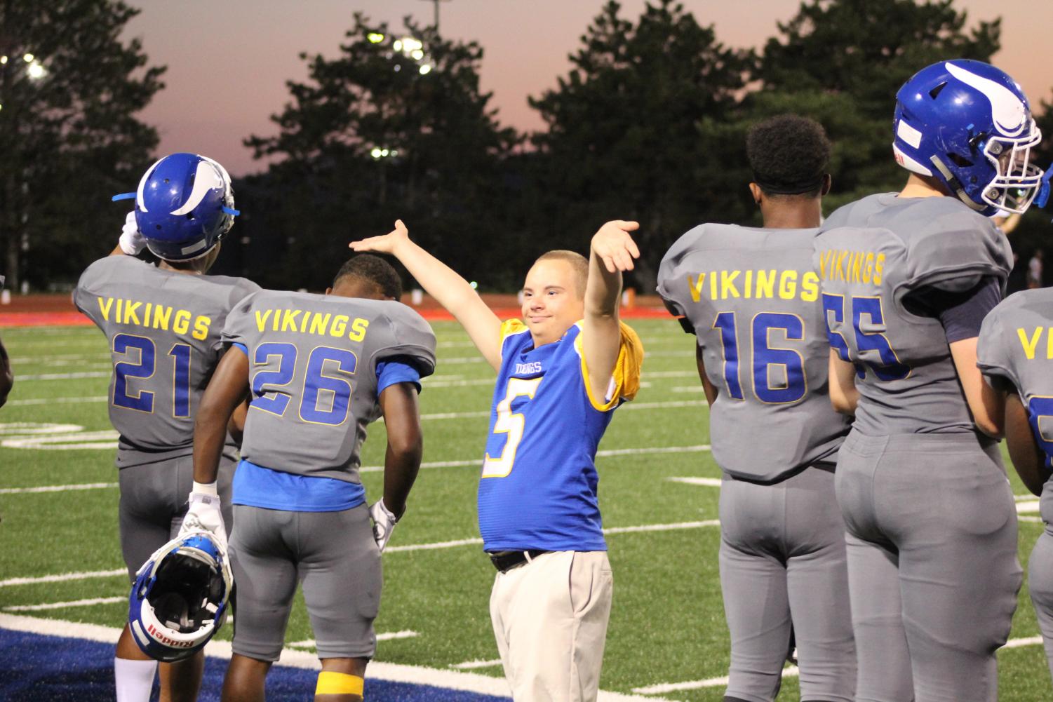 Jordan Burtzel waives his arms up and down to pump up the crowd at the football game against Burke at Northwest’s Kinnick Stadium on September 14, 2018. Burtzel did this to get the crowd into the game, Burtzel often did this throughout the game.
Photo by Gabby Push