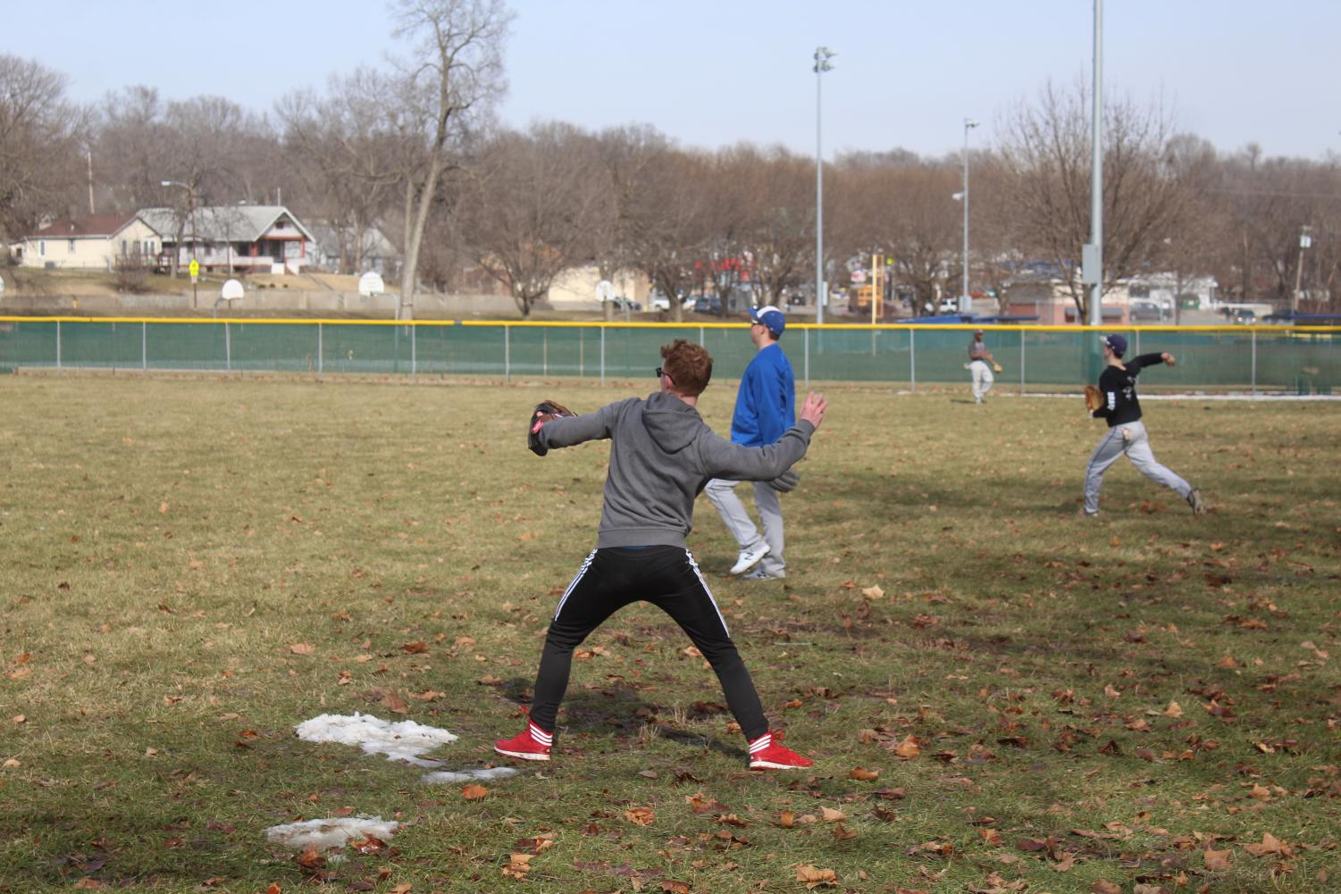 Blake Heuertz, 12, plays catch with one of his teammates to warm up on Mar. 18, 2019.
Photo by Jessica Stacy