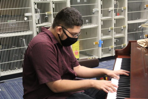 Norlon Burgos, 12, plays piano in his Prep Band class. This is Burgos first year taking a music class at North.