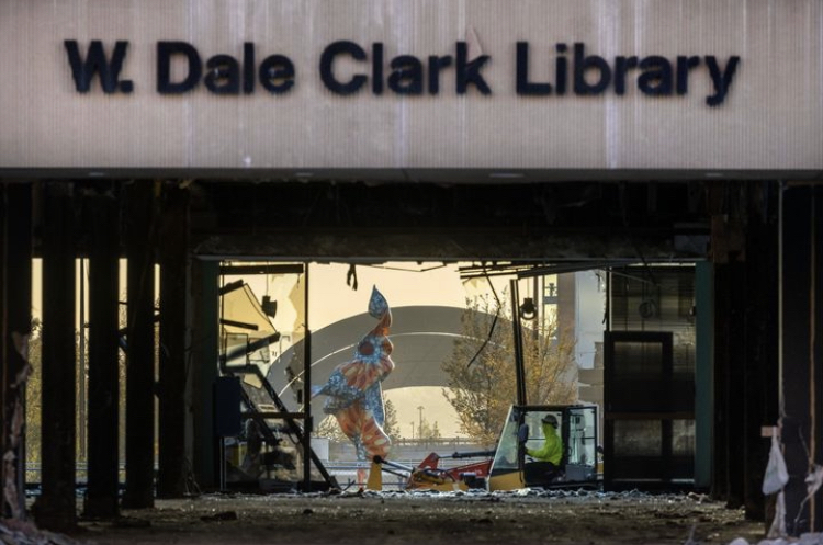 W.+Dale+Clark+Library+sits+with+glass+shattered+on+October+20%2C+2022.+Demolition+began+early+October+2022.+%0APHOTO+BY+CHRIS+MACHIAN