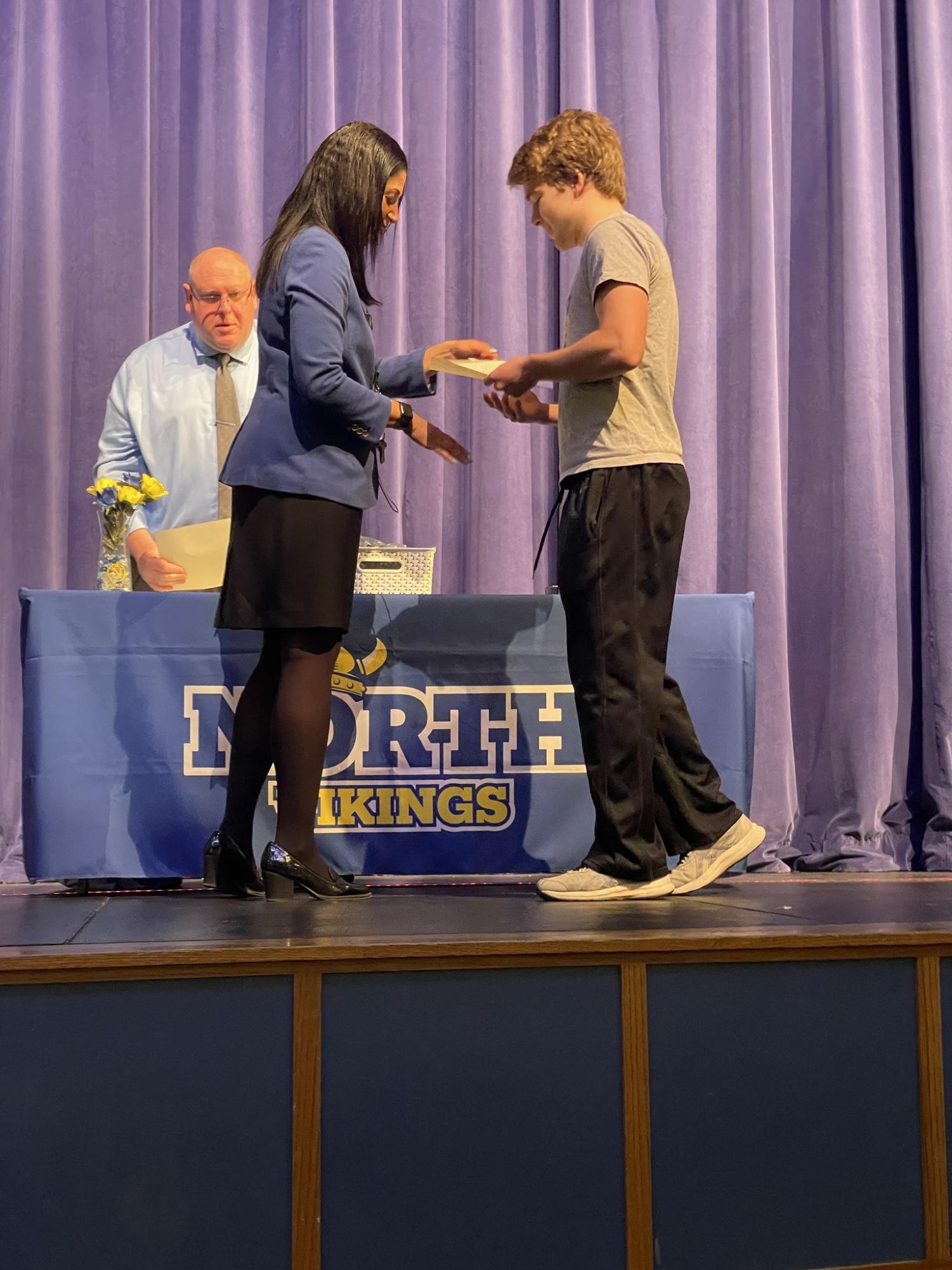 Emerson Schapp, 11, receives his blue and gold award 
PHOTO BY ELIZABETH ANDERSON